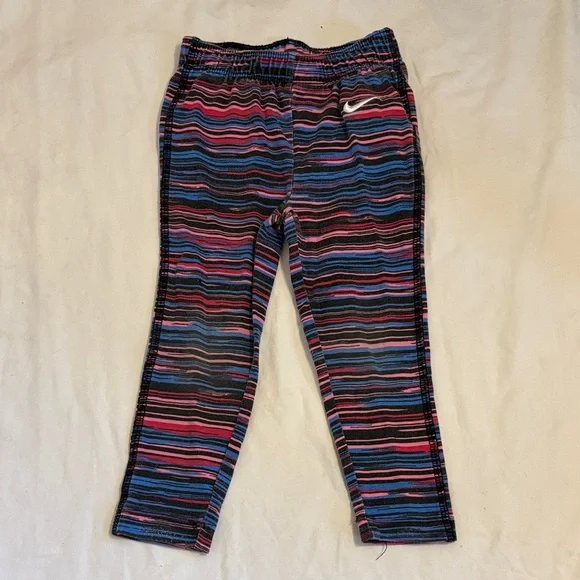 Nike Pink Crop Top with Black Swoosh and Striped Leggings - Picture 4 of 5